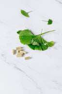 Doxwell Allergy Care Avaleha – herbal capsules with ginkgo leaves on marble