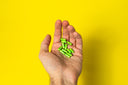 Doxwell Fat Detox Capsules – green herbal capsules in hand